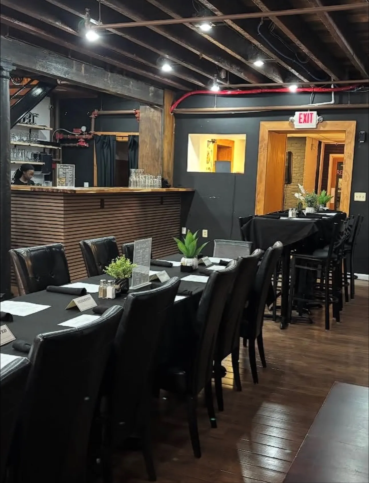Bar seating along the brick wall