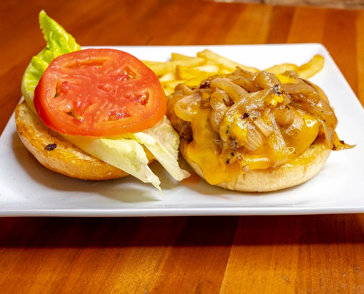 Signature Blancos burger with caramelized onions and fries