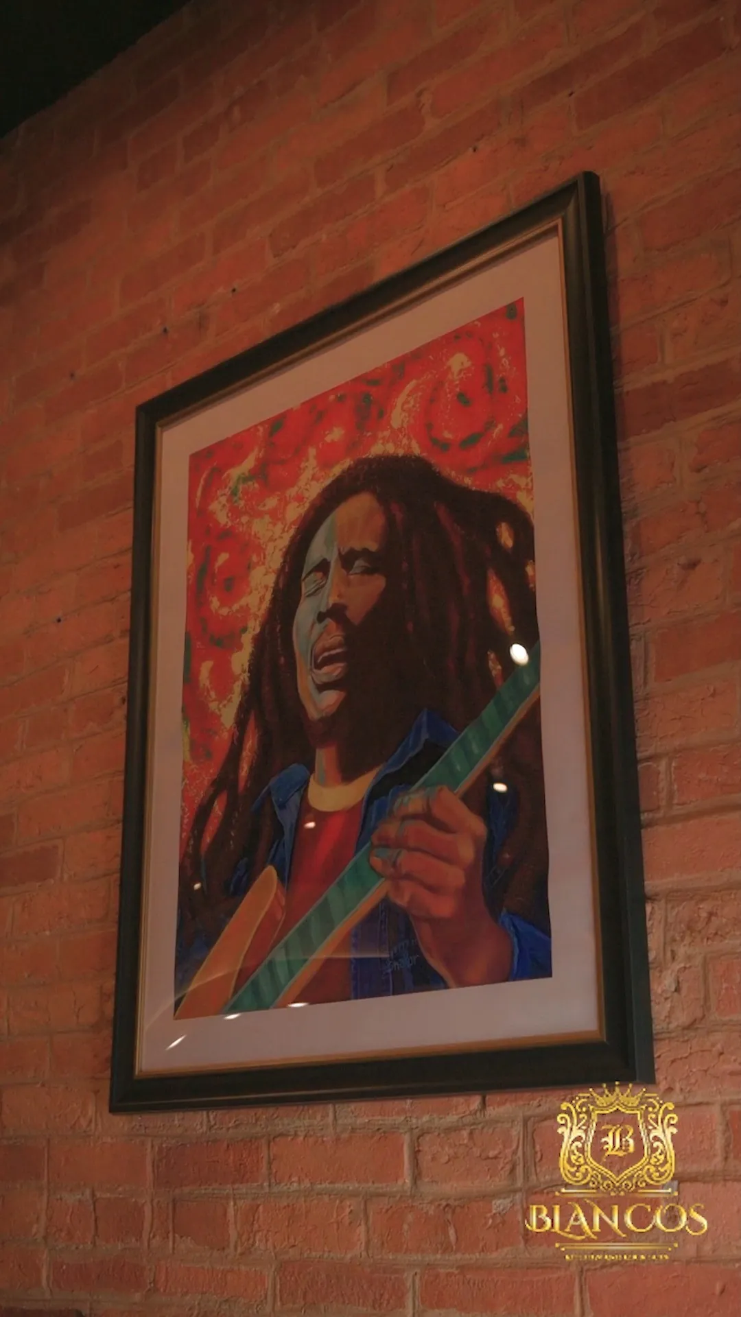 Bob Marley portrait on the exposed brick wall
