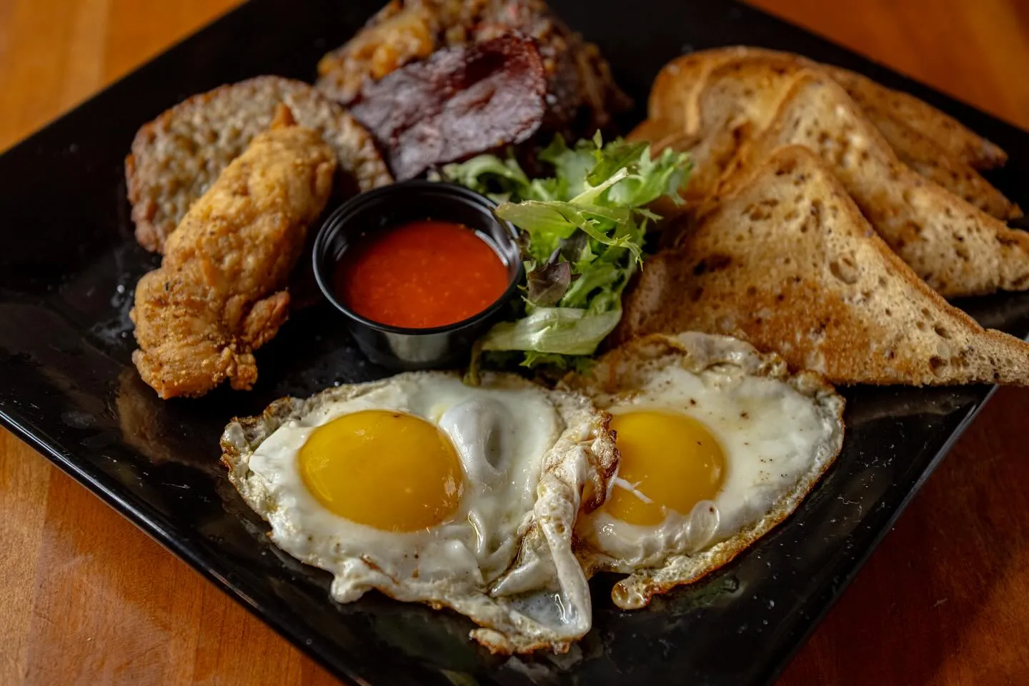 Southern breakfast sampler with eggs, chicken tenders and toast