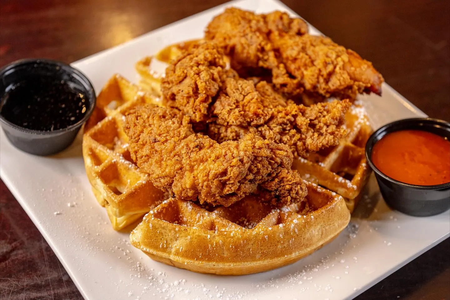 Buttermilk fried chicken tenders over a waffle