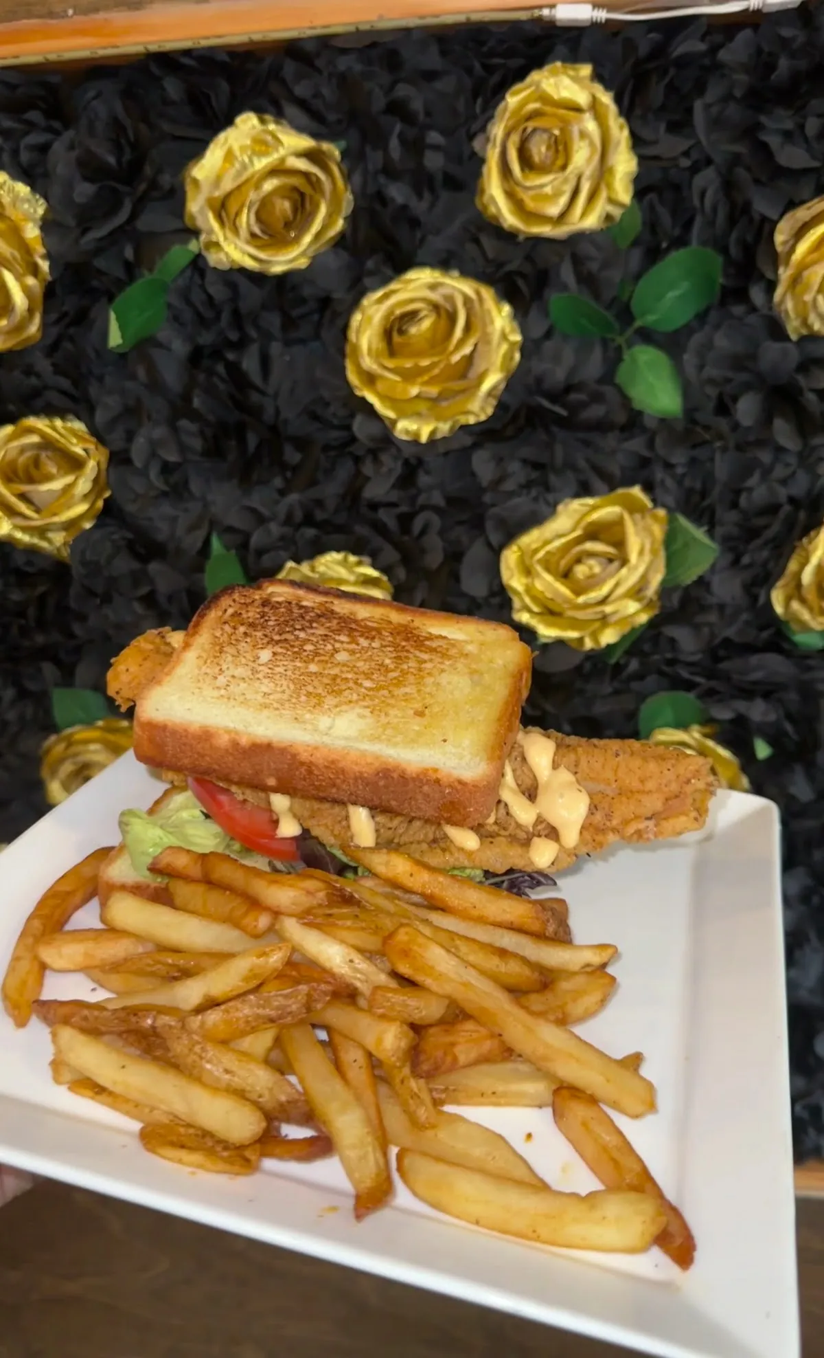 Fried catfish sandwich on Texas toast with fries