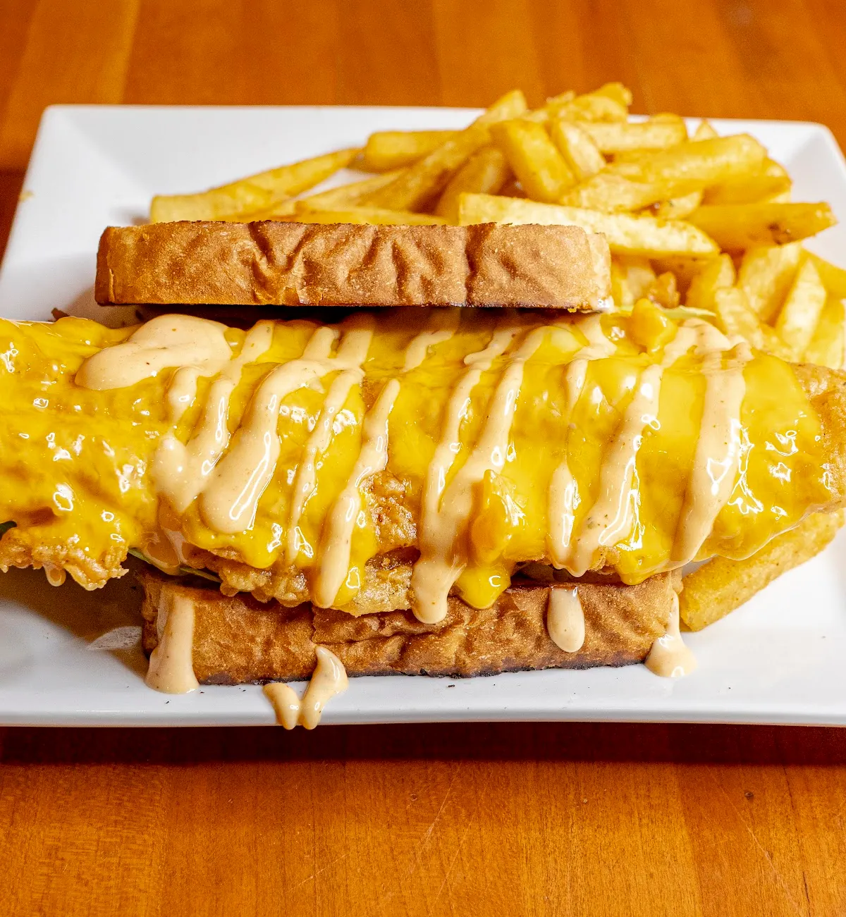 Four cheese grilled cheese stacked on Texas toast
