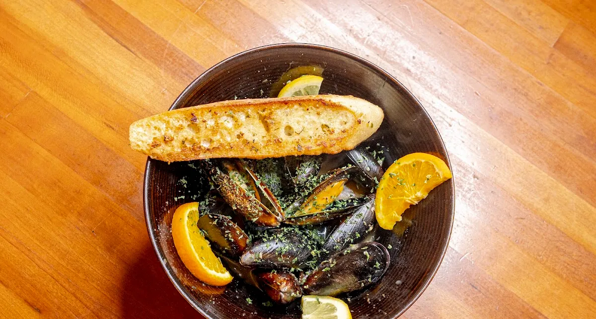 White peach sangria mussels with garlic toast