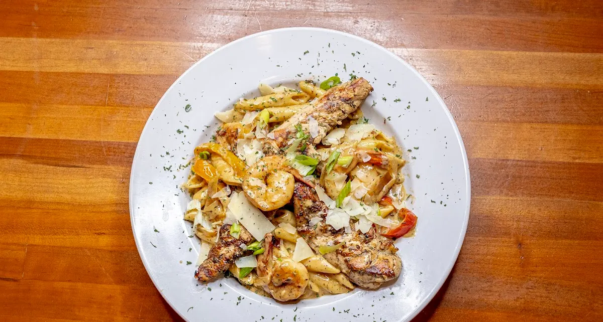 Shrimp pasta finished with shaved parmesan