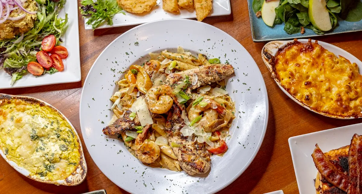 A table spread with several dishes for sharing